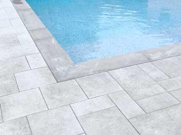 paving slab work around pool deck